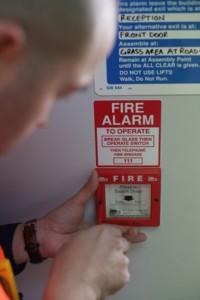  Fire Alarm Monitoring Services - Tech conducting testing at site